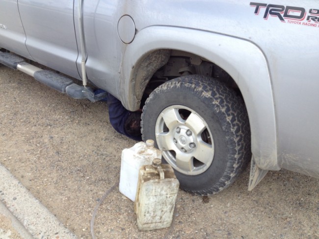 The mechanic is under the truck