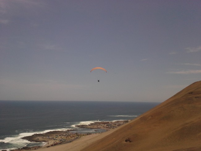 Paragliding above the beach