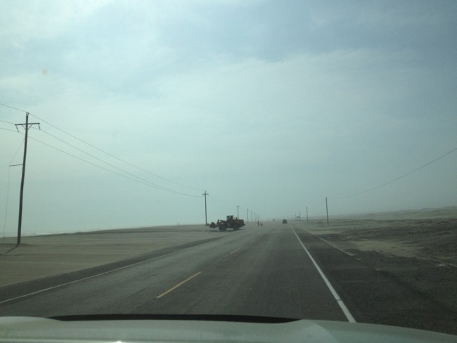 Cleaning sand off the road