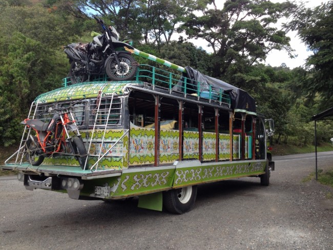 The motorbikes go up and come down from the roof with people power.