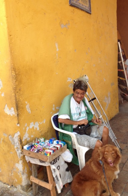 Capi made friends with a woman who sells gum and candies in old town.